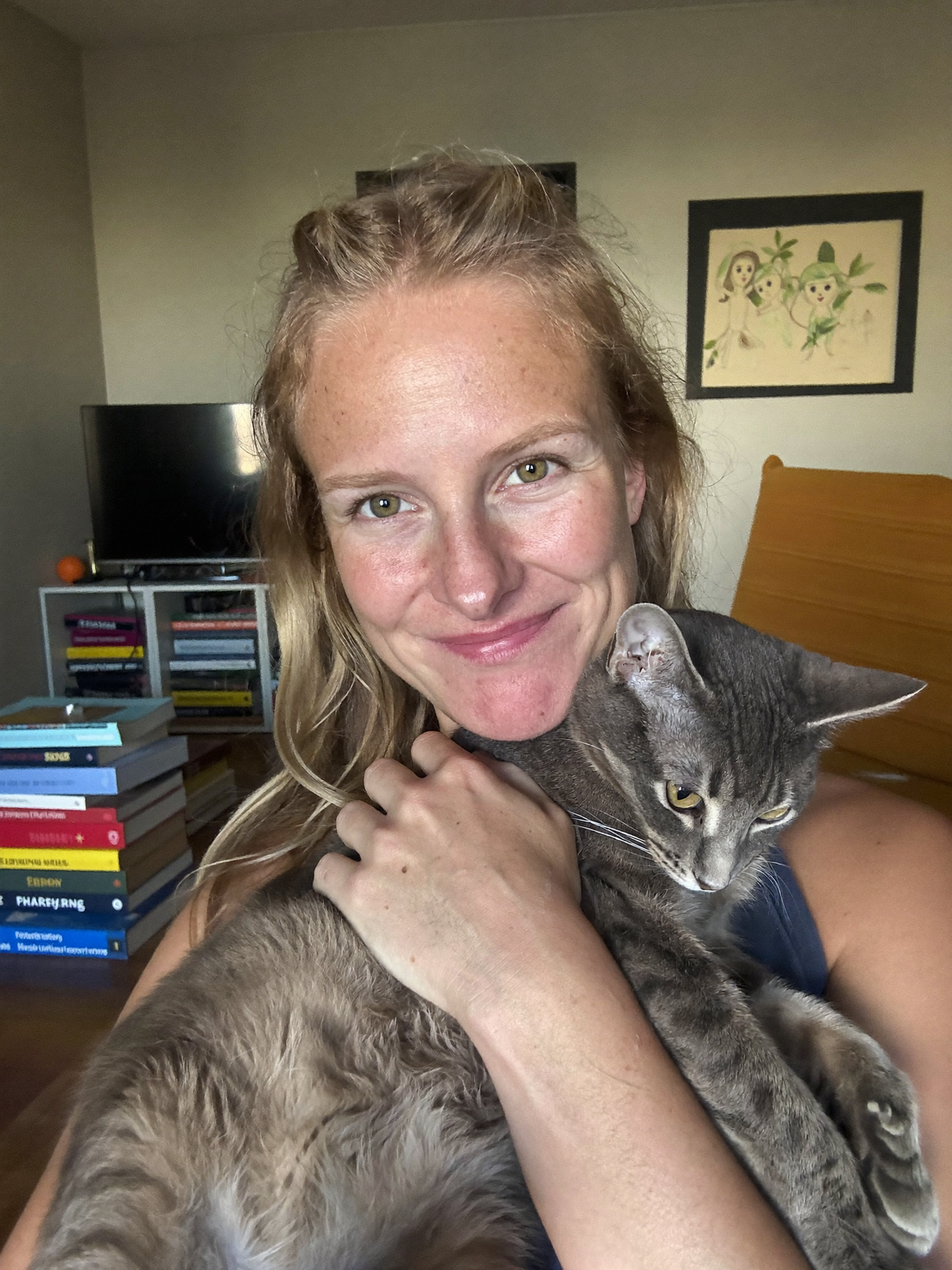 Lifestyle image of a cat and owner at home